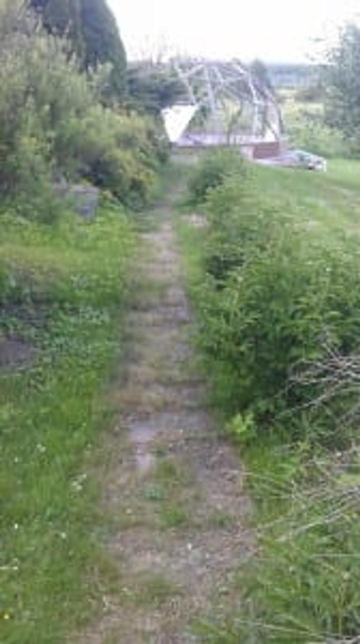 Pathway to a 26' Growing Dome greenhouse under construction