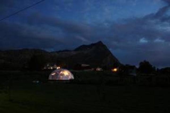 26' Growing Dome greenhouse at night with lights inside