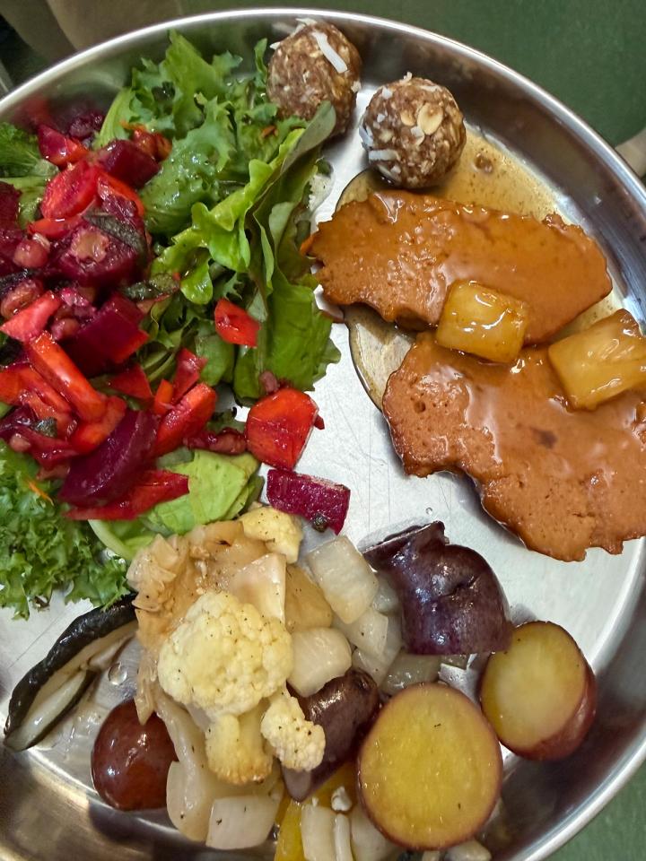 Kula Kamala meal lots of vegetable variety colorful salad cauliflower and potato dish pancake like dish with pineapple