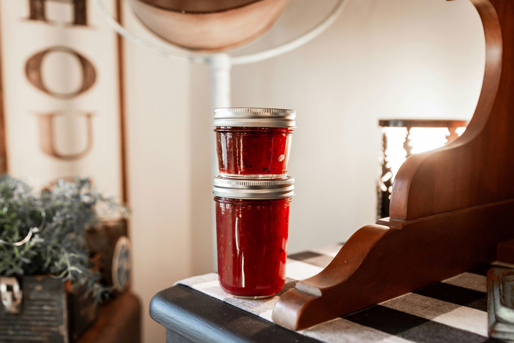 two jars of jelly stacked on top of each other