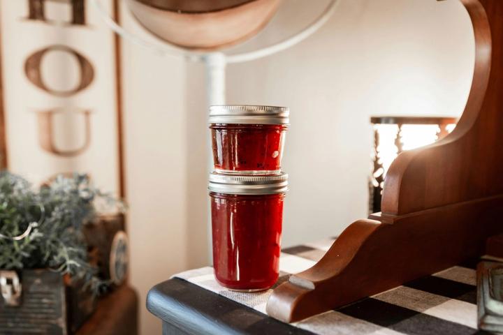 two jars of jelly stacked on top of each other