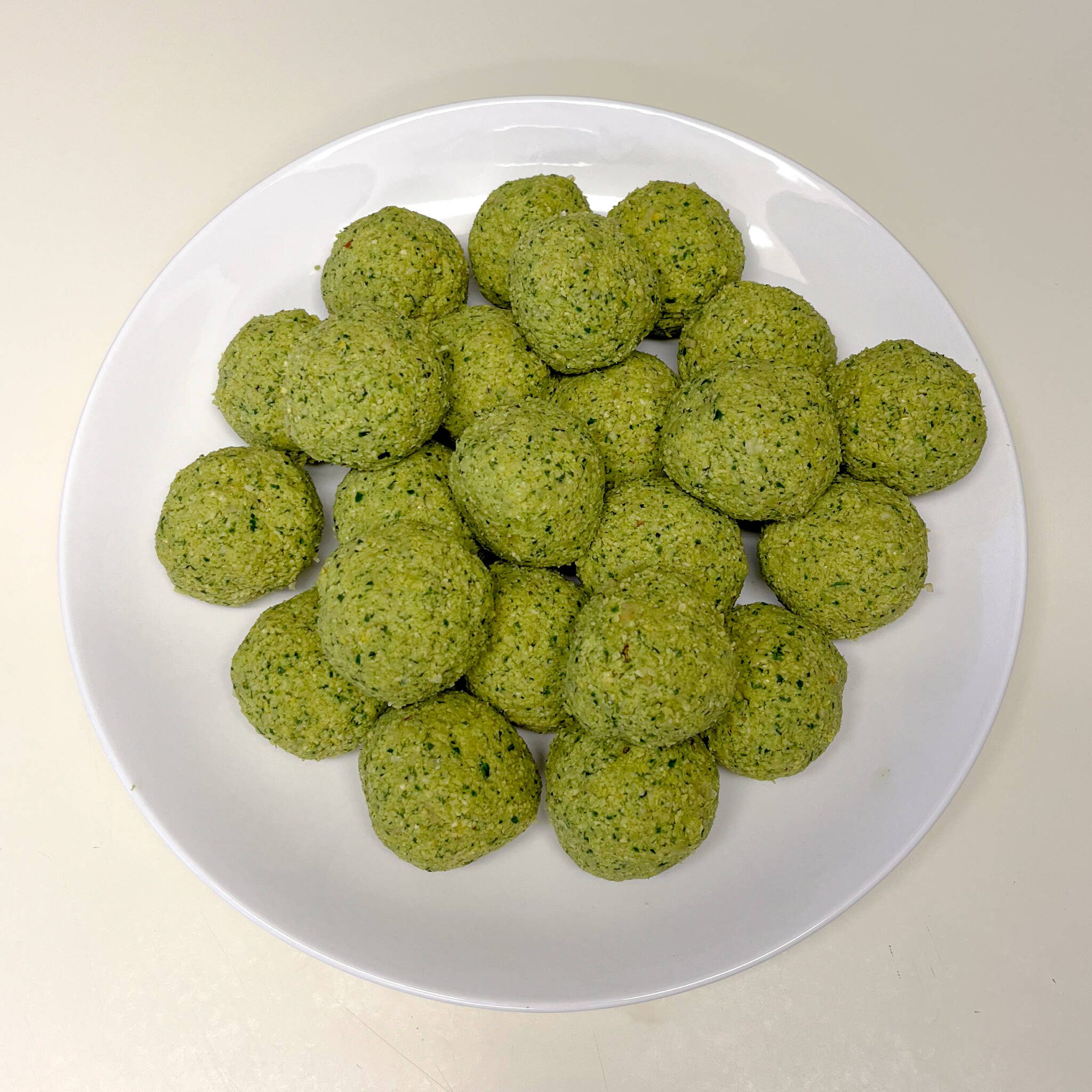 falafel mix formed into balls and piled on a plate