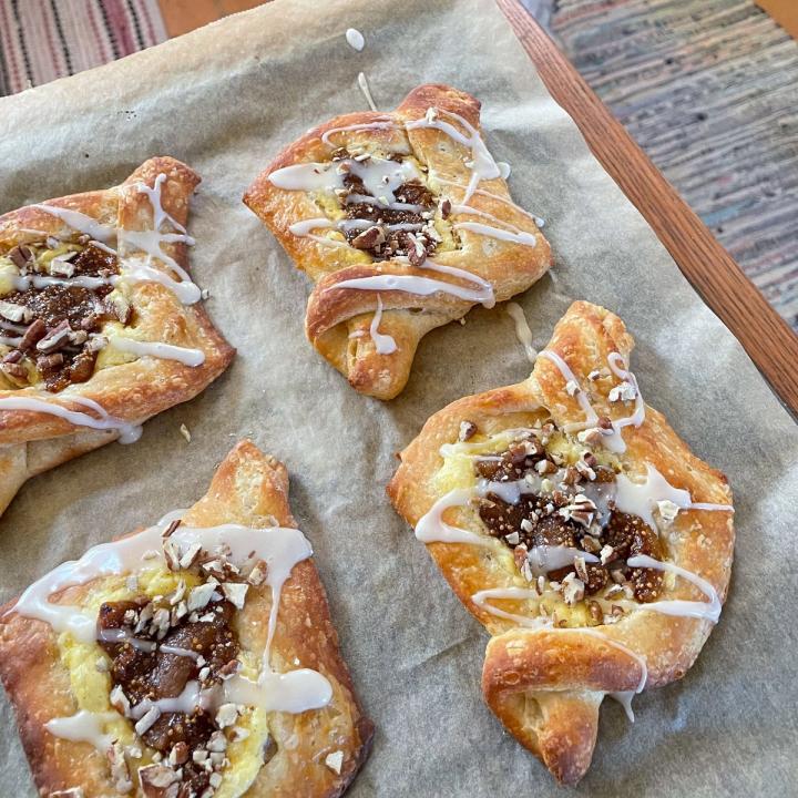 fig jam danishes cooling on a baking sheet lined with parchment paper