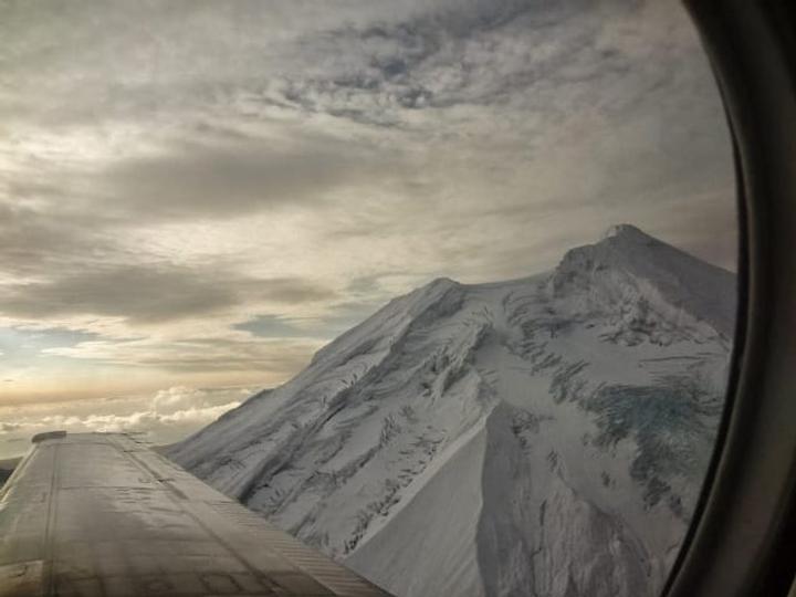Photo of mountain from small plane