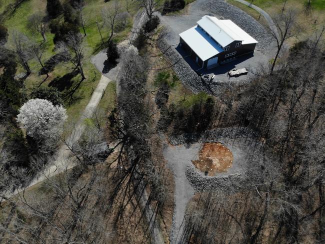 arial view of dome greenhouse building site with roads and barn