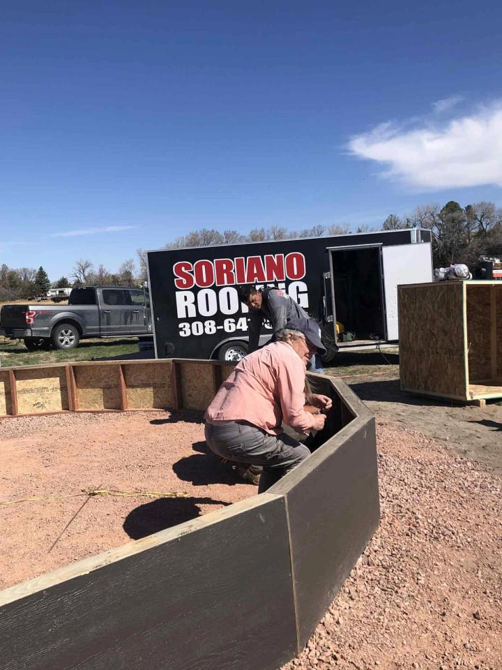Nielson's Nebraska greenhouse installing the foundation wall