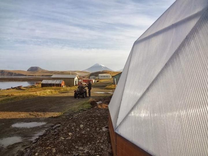 growing dome greenhouse on island with harsh weather conditions