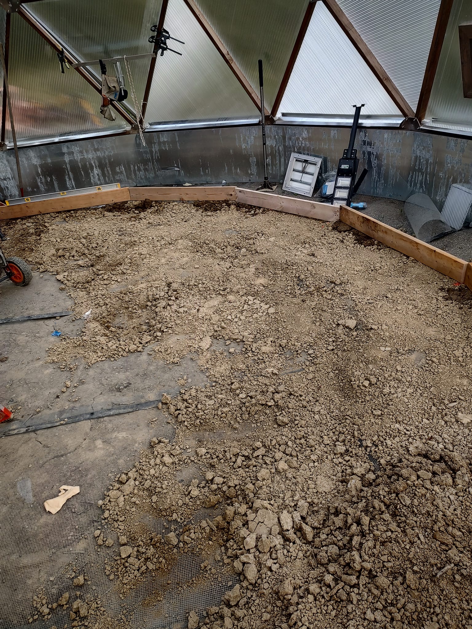 hardware cloth under greenhouse foundation to protect against burrowing rodents