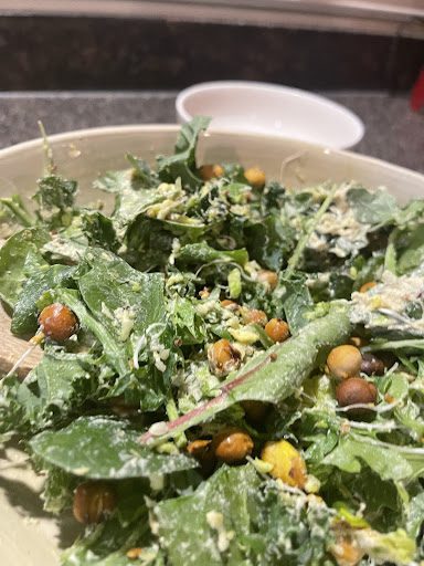 closeup of a tossed Pistachio and Chickpea Caesar Salad