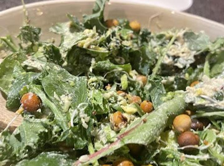 closeup of a tossed Pistachio and Chickpea Caesar Salad