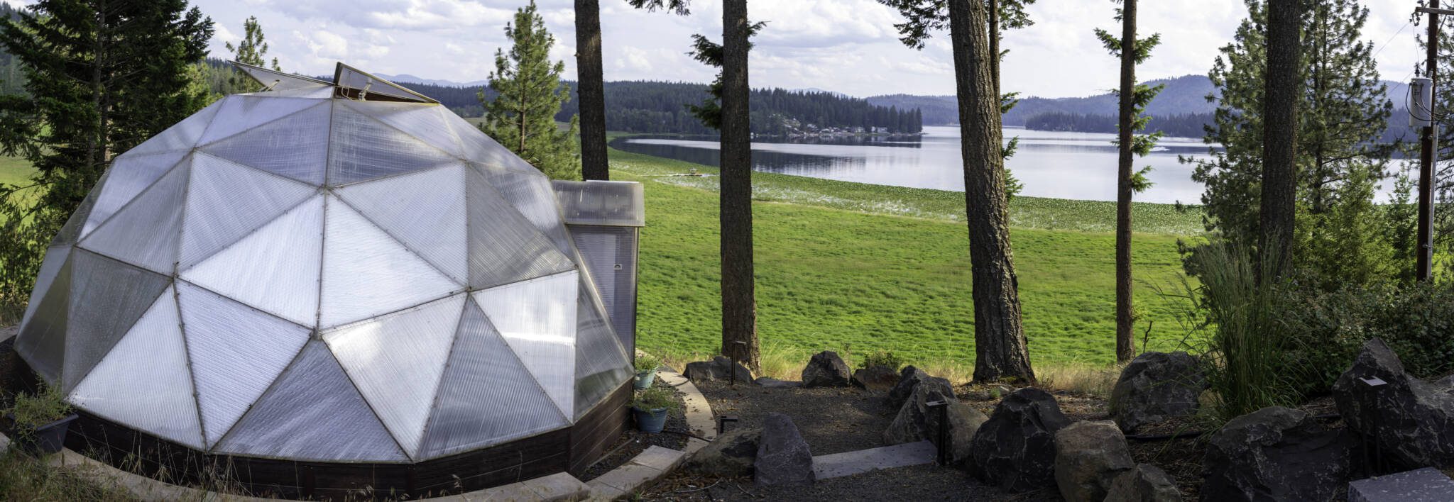 Growing Dome greenhouse near a Washington lake