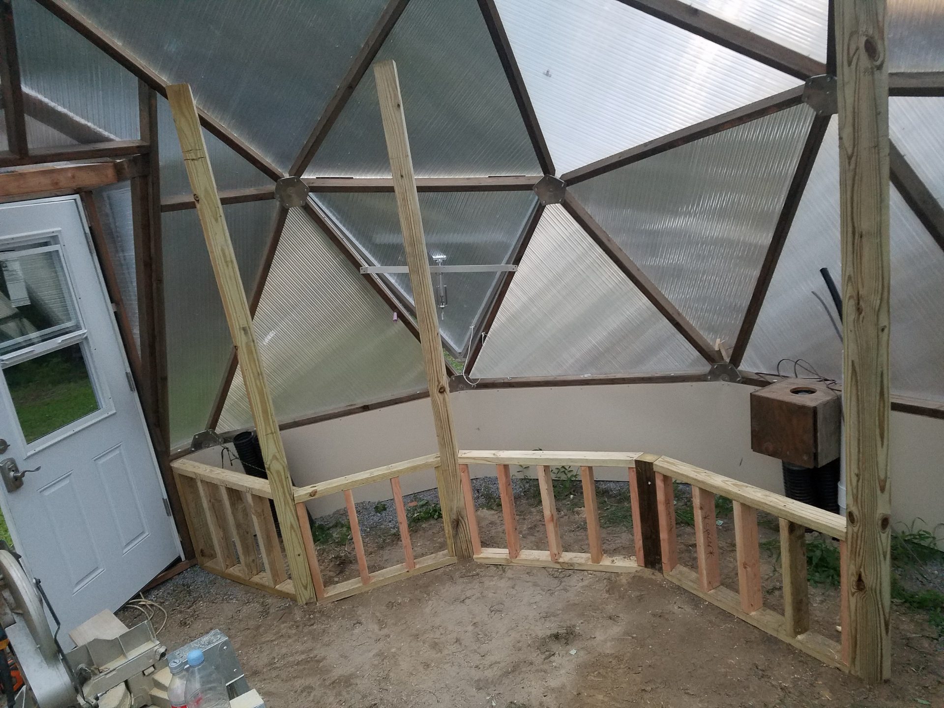 Wooden raised beds being built inside a Growing Dome in Clayton, North Carolina