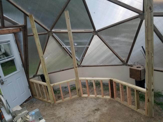 Wooden raised beds being built inside a Growing Dome in Clayton, North Carolina