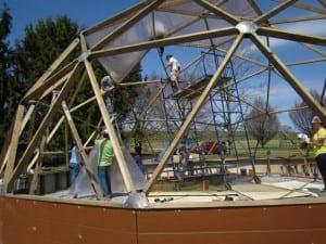 Installing polycarbonate panels on a 33' Growing Dome greenhouse