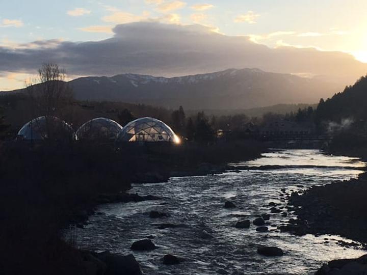 Sunset over three 42' Growing Dome Greenhouses in Pagosa Springs, CO