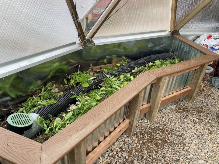 leaves and organic matter in hugelkultur raised beds