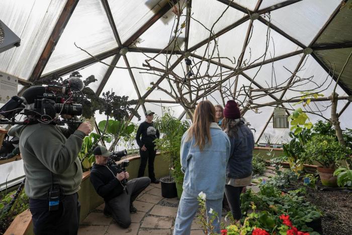 HGTV filming an episode of Building Roots in a Growing Dome Greenhouse