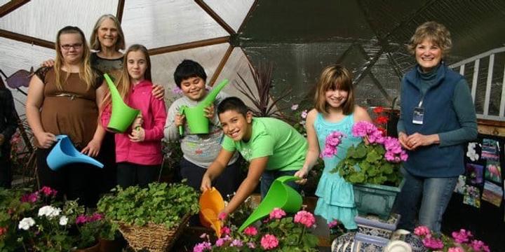 Kids in a Growing Dome Greenhouse in Oregon School