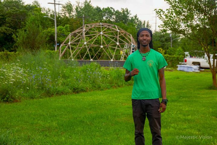 man standing in front of wellness sanctuary being built
