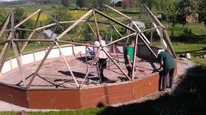 Crew members building a 26' Growing Dome greenhouse