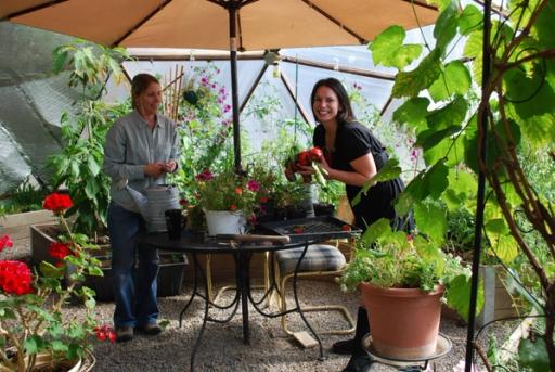 Gardeners planting seeds and harvesting vegetables from a Growing Dome greenhouse
