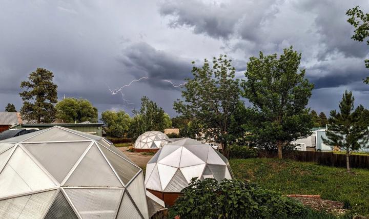 thunderstorm over greenhouses