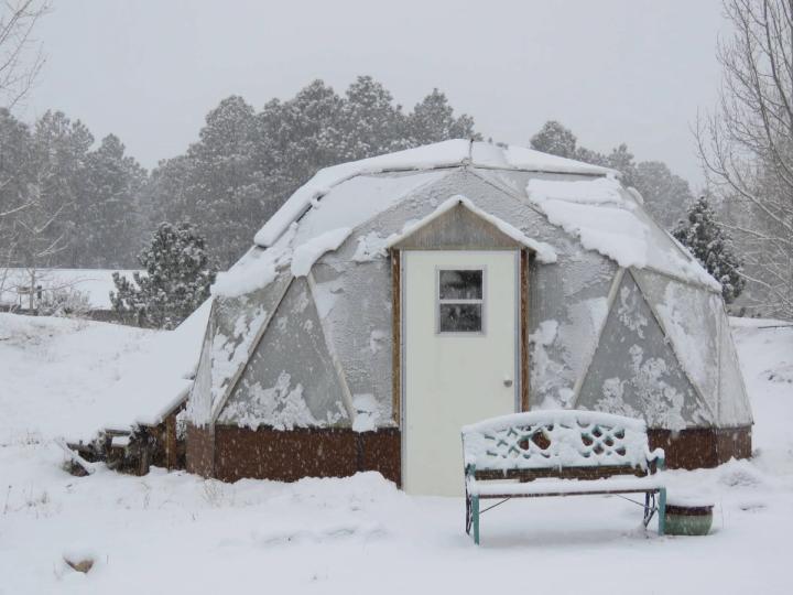 Growing Dome Greenhouse covered in snow