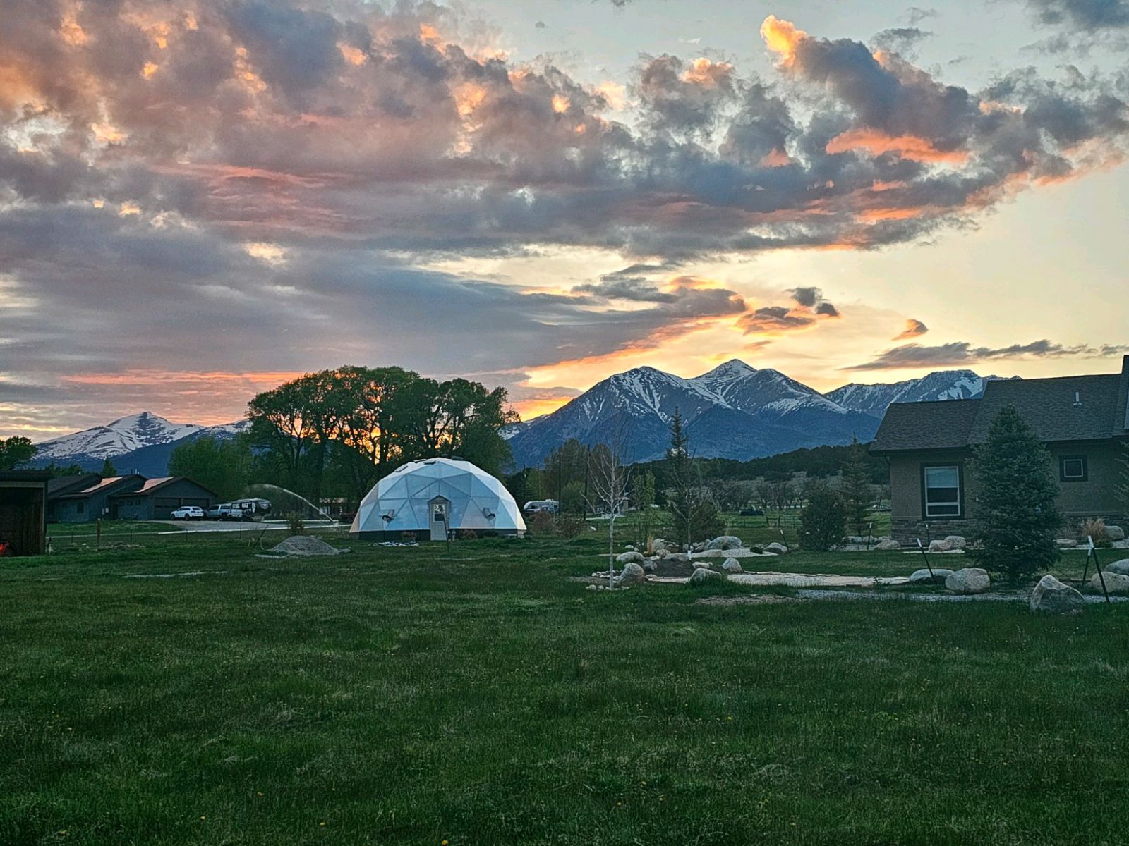 Growing Dome greenhouse backed by the Cascade peaks