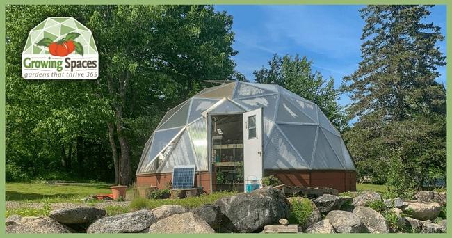 Growing Dome surrounded by boulders and summer vegetation in Steuben, Maine
