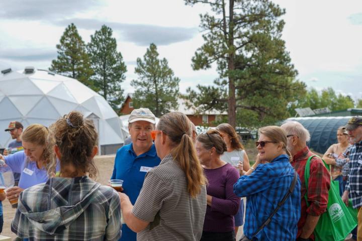 Group of Growing Dome owners mingling outside the 42' Growing Dome.