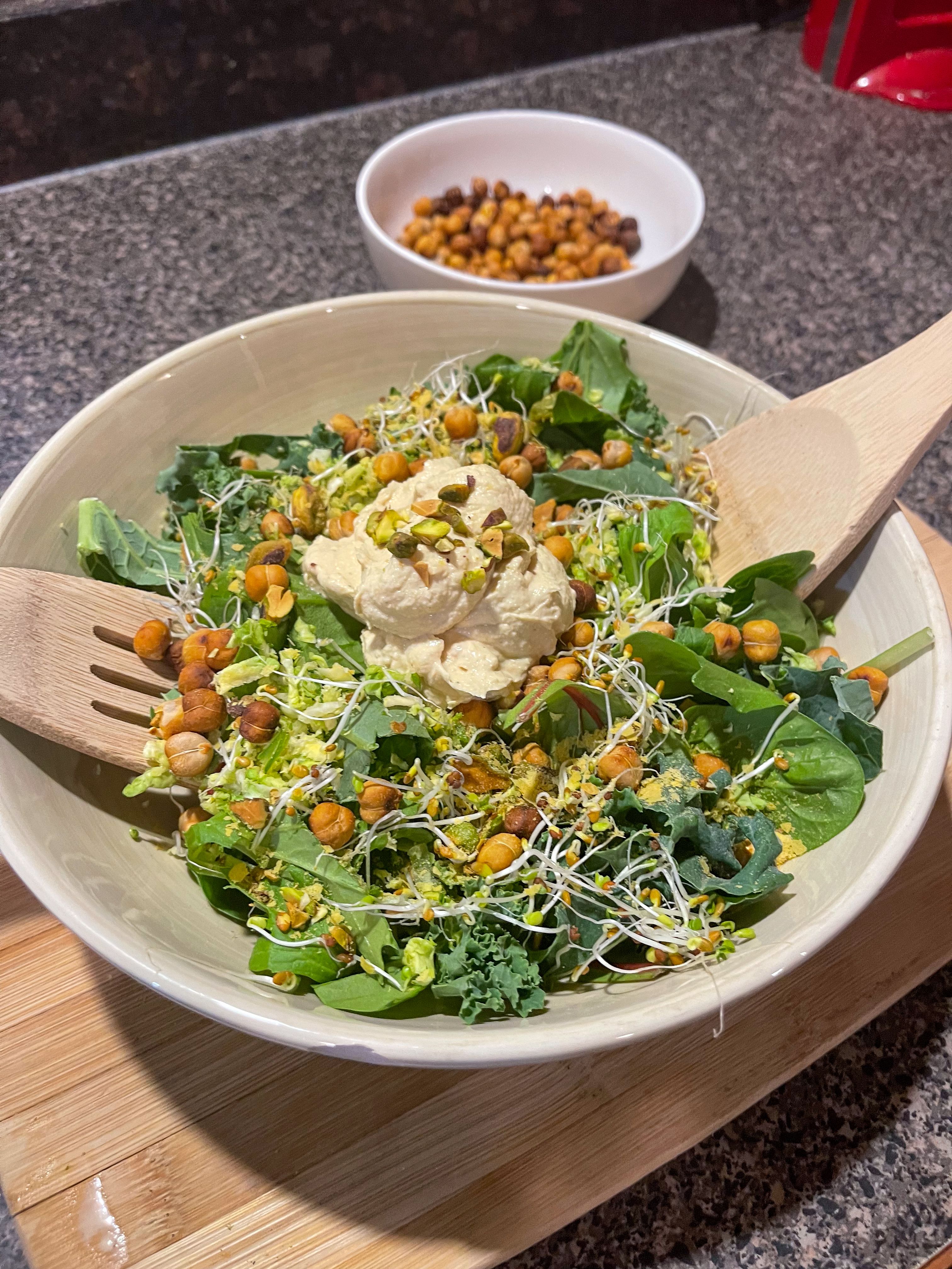 pistachio and chickpea caesar salad in a bowl