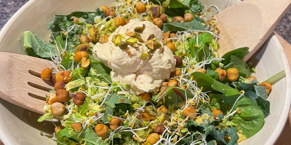 pistachio and chickpea caesar salad in a bowl