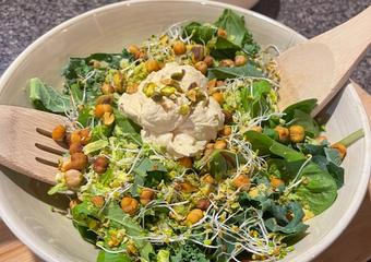 pistachio and chickpea caesar salad in a bowl