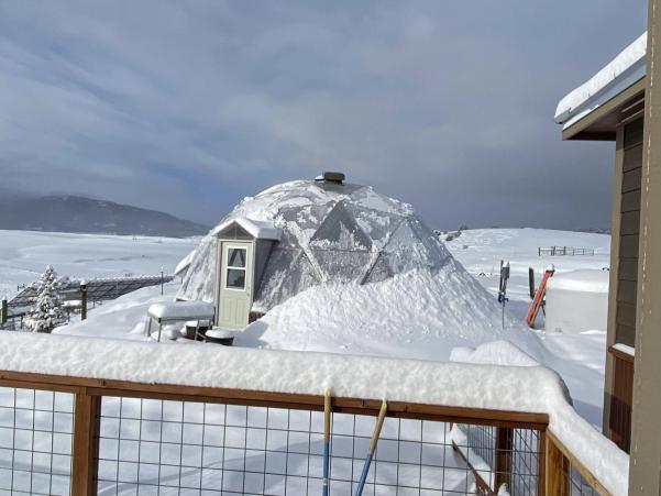 Tommy & Leslie's 26' Growing Dome greenhouse during a snowy winter in the rocky mountains