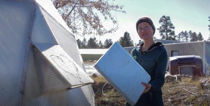 Sealing up the greenhouse with rigid foam over fans