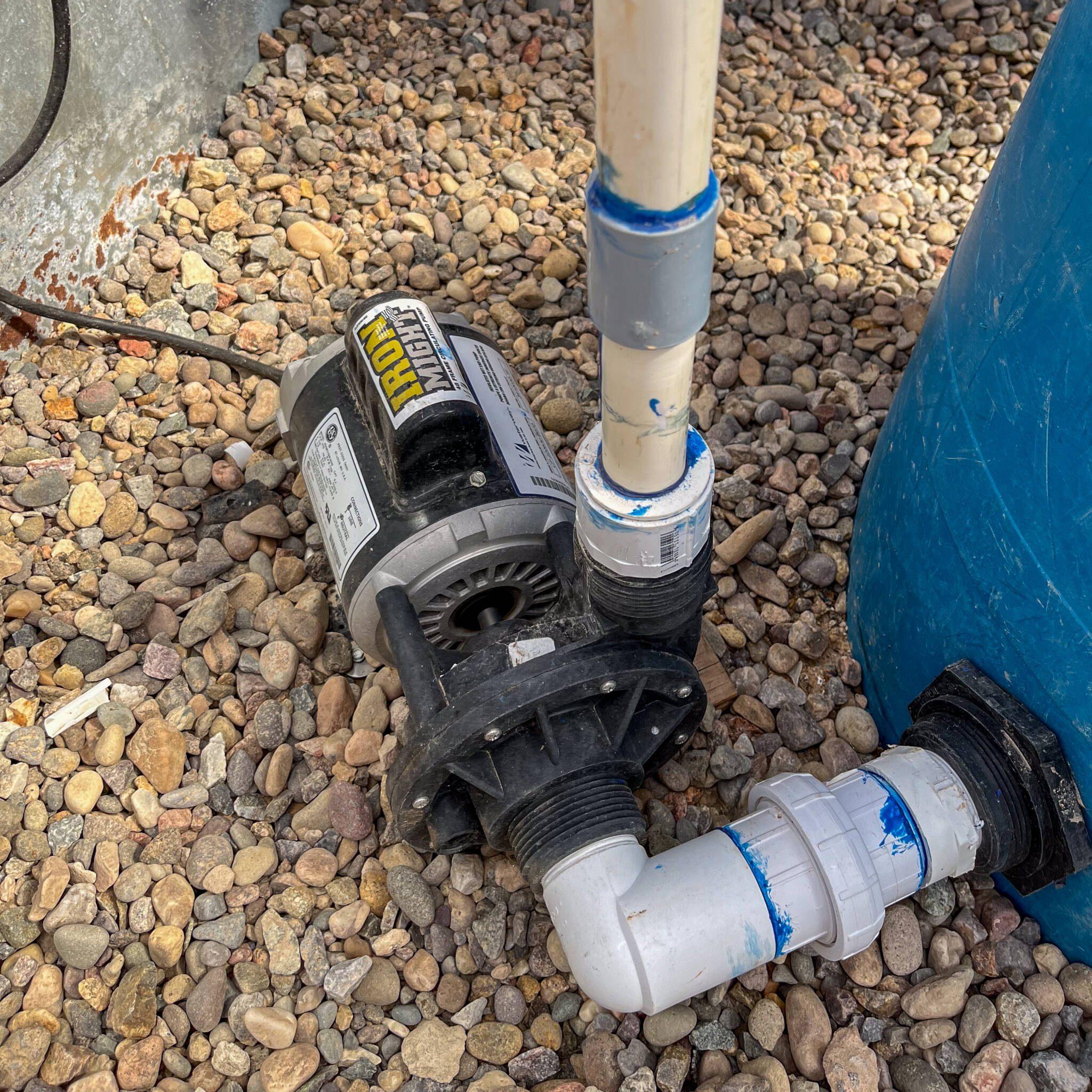 pump located at the lowest point of the system and pvc pipes running to the tanks