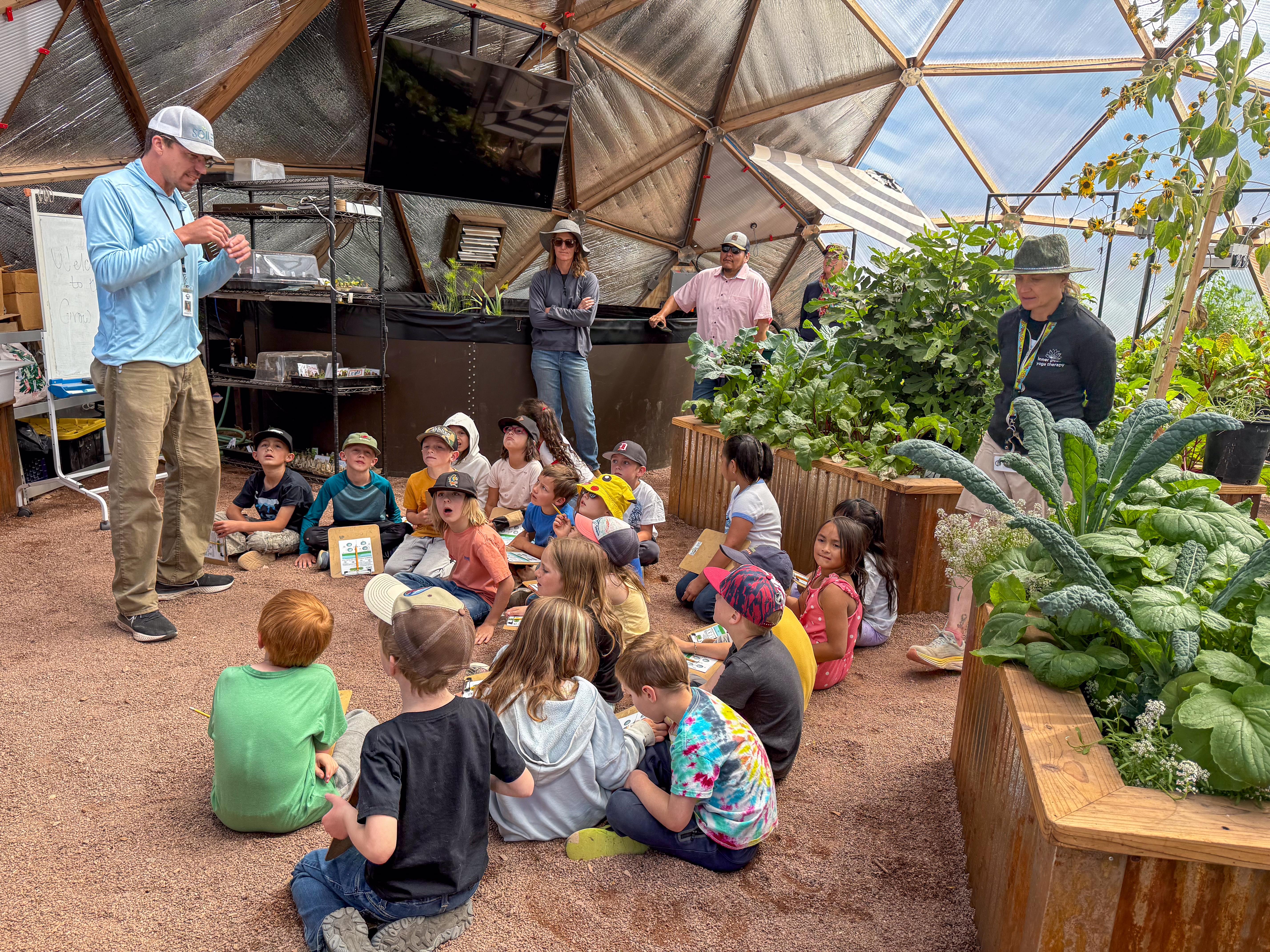 Children learning in the SOIL lab growing dome