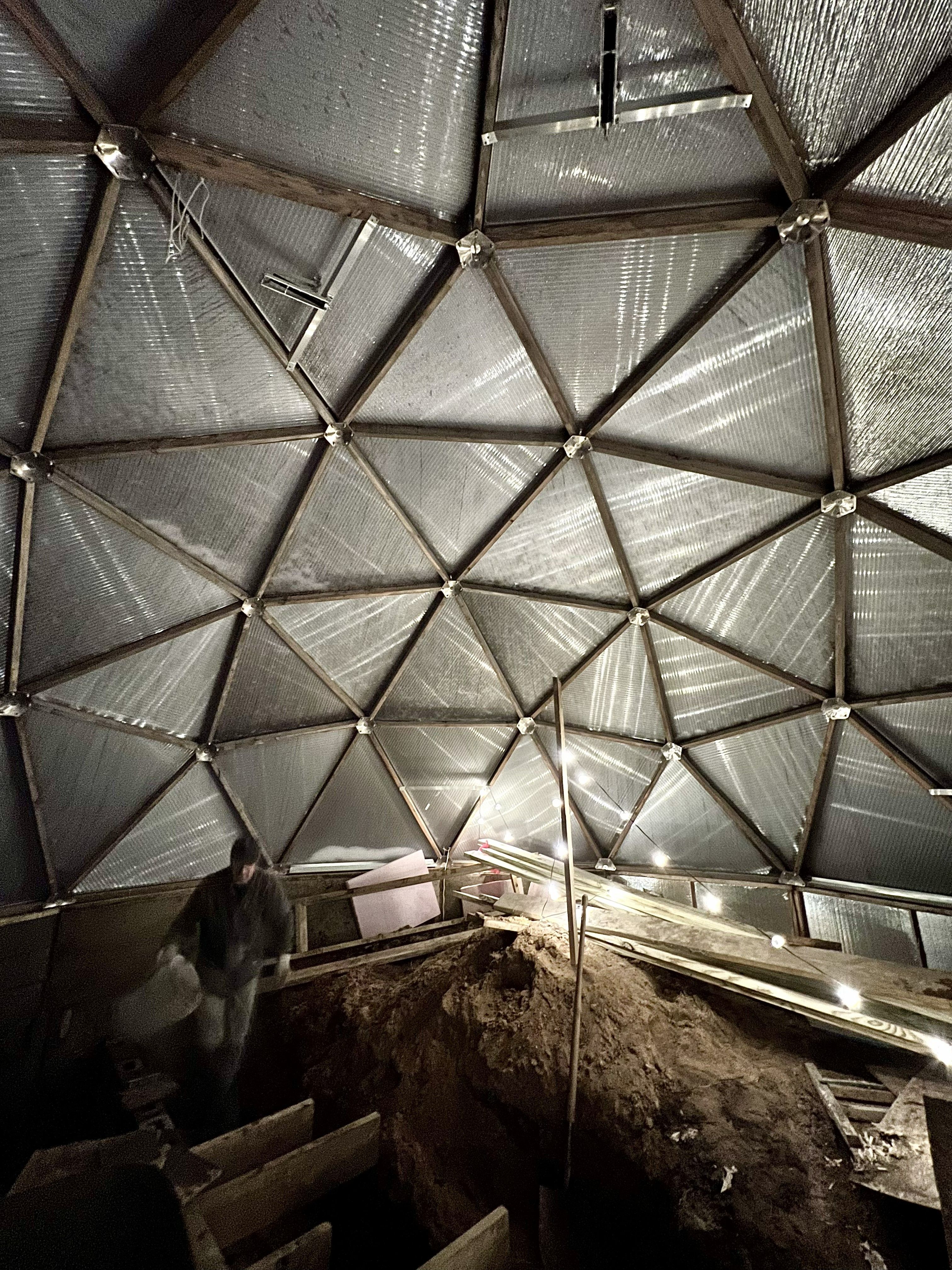 Growing Dome frame and reflective north wall during construction in Northern Michigan
