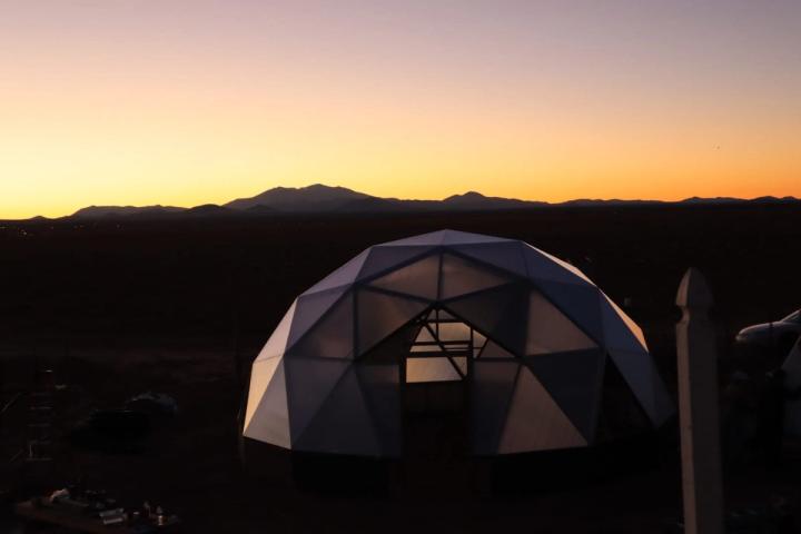 Growing Dome under construction at sunset