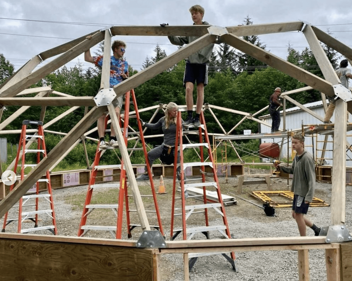 people building geodesic dome