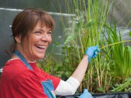 Garden Pond Expert Posing in front of her floating pond plants