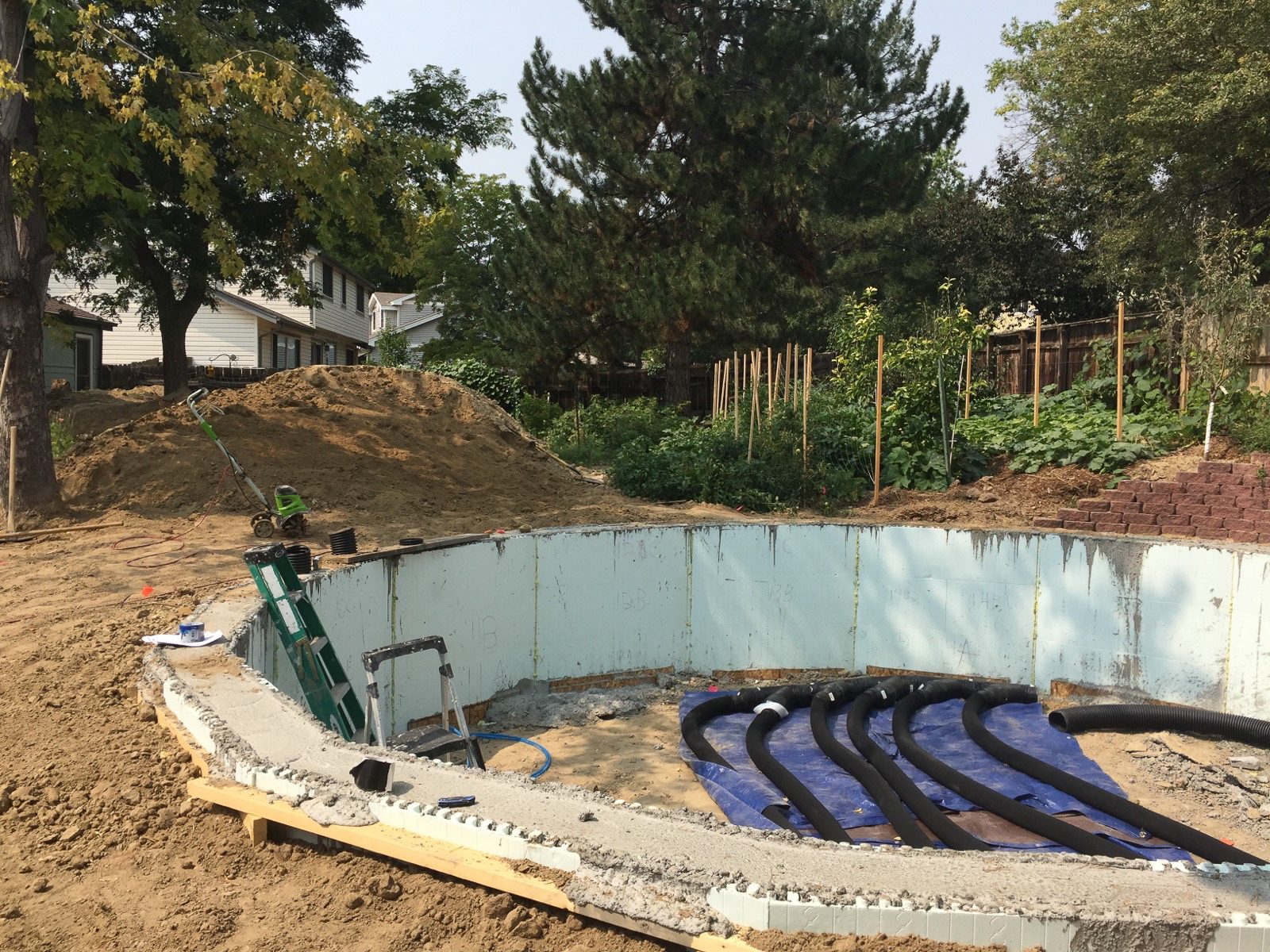 climate battery earth tubes being installed