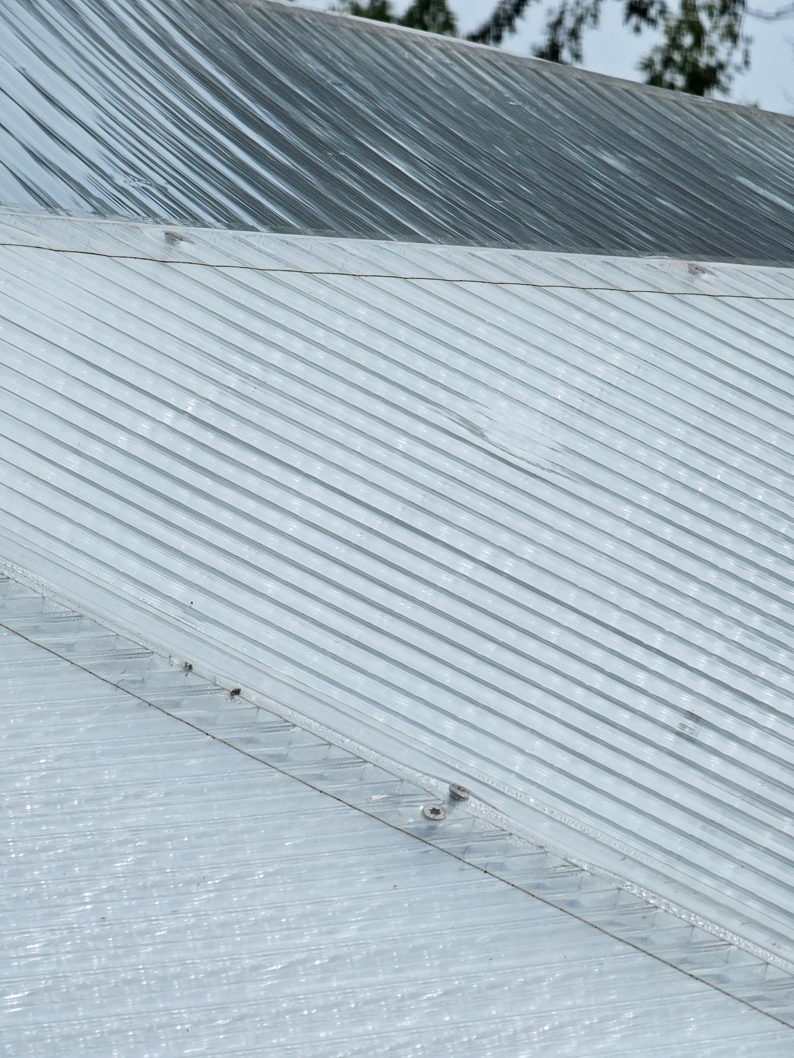 polycarbonate panel on a dome greenhouse with a dent from large hail