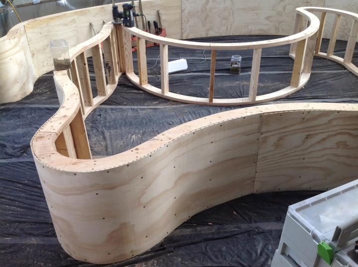 Curved wooden planting beds