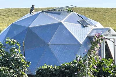 Growing Dome greenhouse in the Nebraska prairie with a big atop