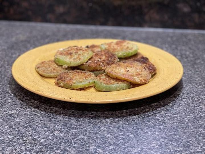 finished fried green tomatoes on yellow  plate