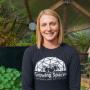 Smiling Growing Spaces Employee Seated in a Growing Dome Greenhouse