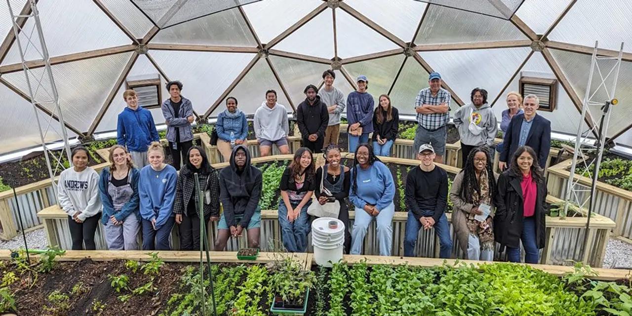 Andrews University students visiting the Unity Gardens Growing Dome