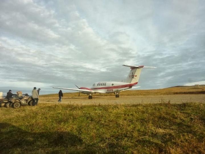 greenhouse installers travel on small plane