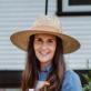A woman wearing a hat
